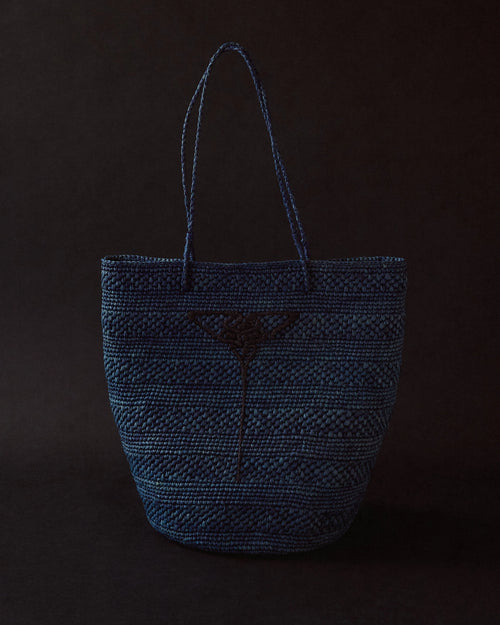 Blue hand-crocheted raffia tote by EMILY DAWN LONG with hand-embroidered Art Nouveau fan motif.
