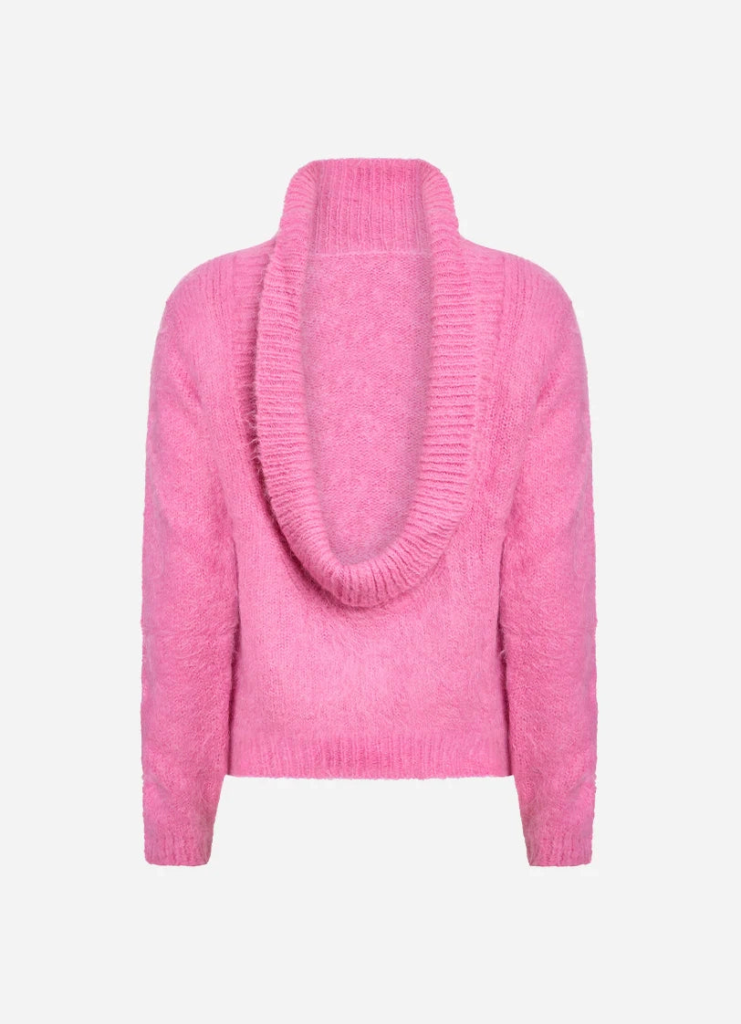 Pink knitted sweater on a white background