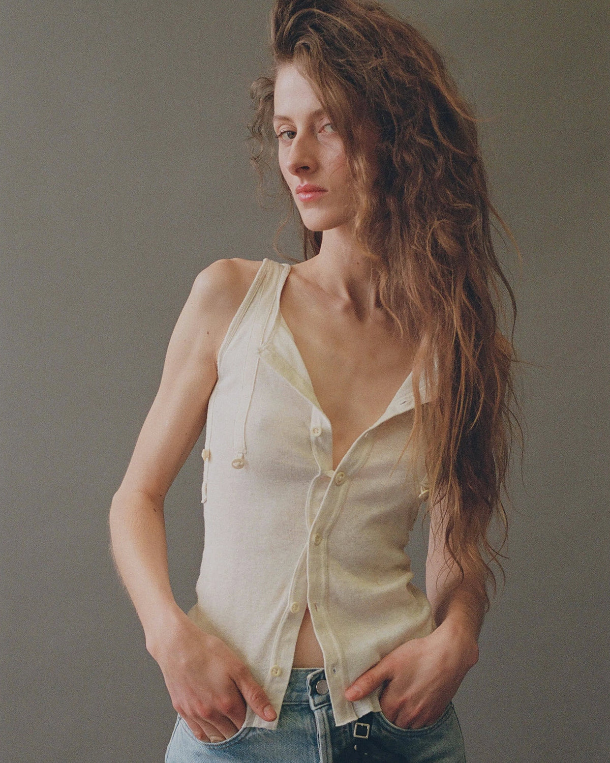 Model wearing Willow 1890 Ribbed Tank in Ivory by EMILY DAWN LONG