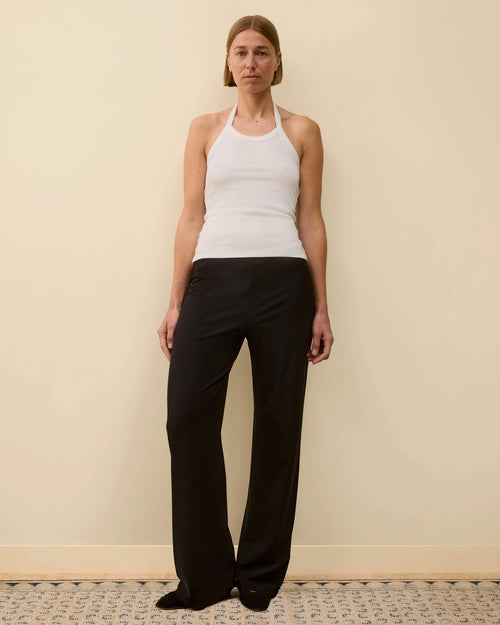 Model wearing Angie Tank in White by FLORE FLORE