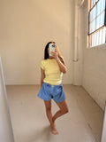 Model wearing FLORE FLORE Car Baby Tee in Camomile
