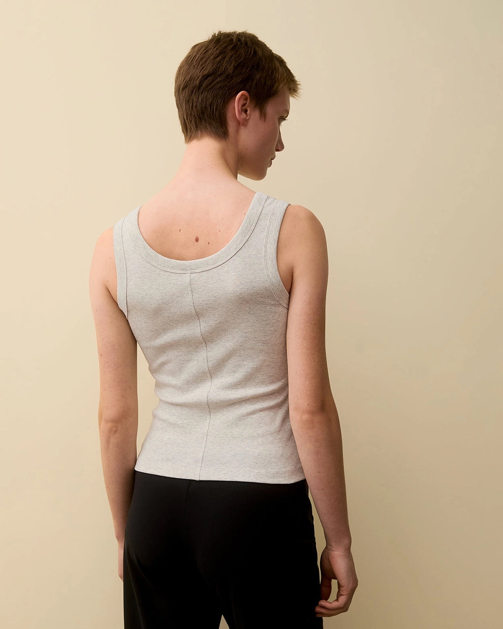 Back view of model wearing Hillie Tank in Heather Grey by FLORE FLORE