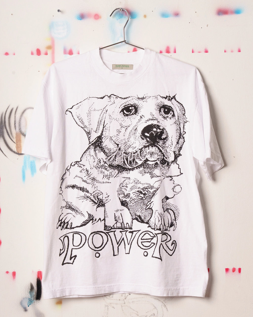 White Henry Johnson graphic tee with oversized black dog illustration and POWER lettering on the front.
