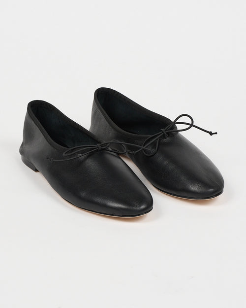 Jamie Haller High Vamp Ballet in black with an elongated shape and elastic bow tie.