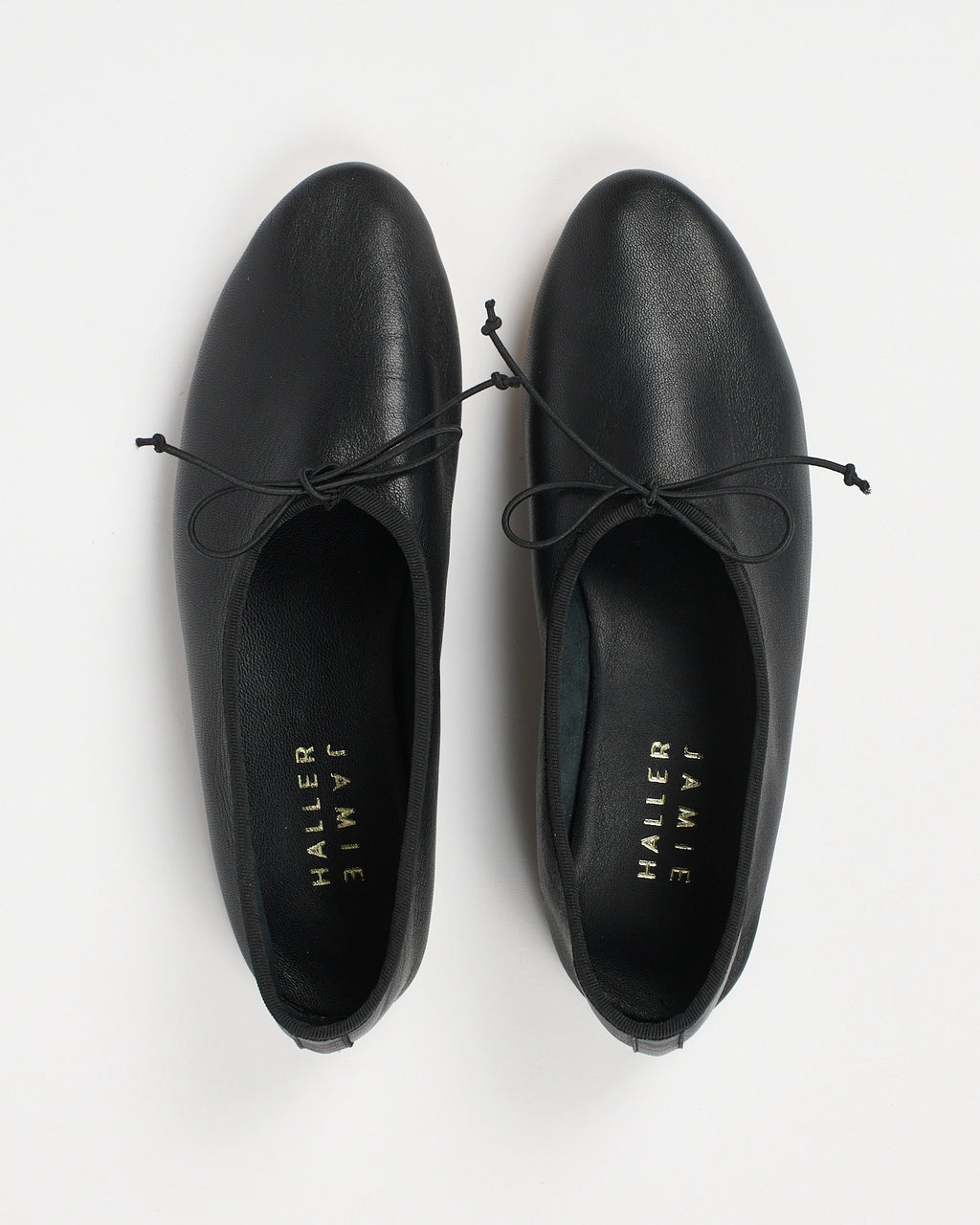 Jamie Haller High Vamp Ballet in black with an elongated shape and elastic bow tie.