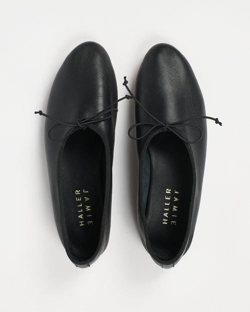 Jamie Haller High Vamp Ballet in black with an elongated shape and elastic bow tie.