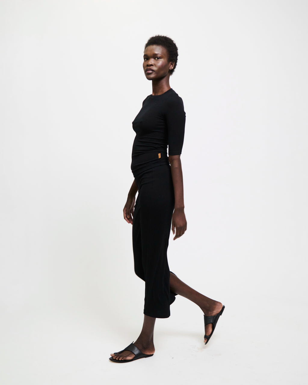 Model wearing The Rib Pencil Skirt in Black by Jamie Haller.