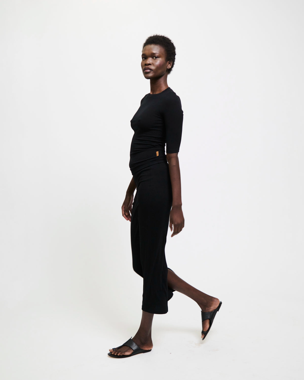Model wearing The Rib Pencil Skirt in Black by Jamie Haller.