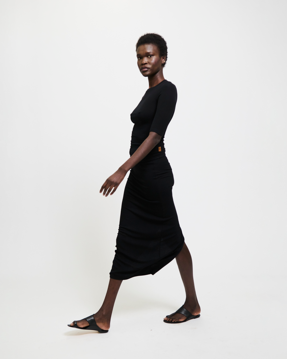 Model wearing The Rib Pencil Skirt in Black by Jamie Haller.