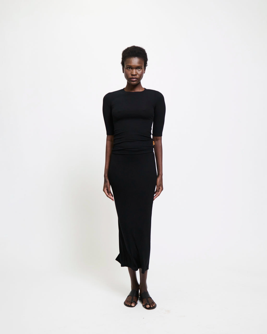Model wearing The Rib Pencil Skirt in Black by Jamie Haller.