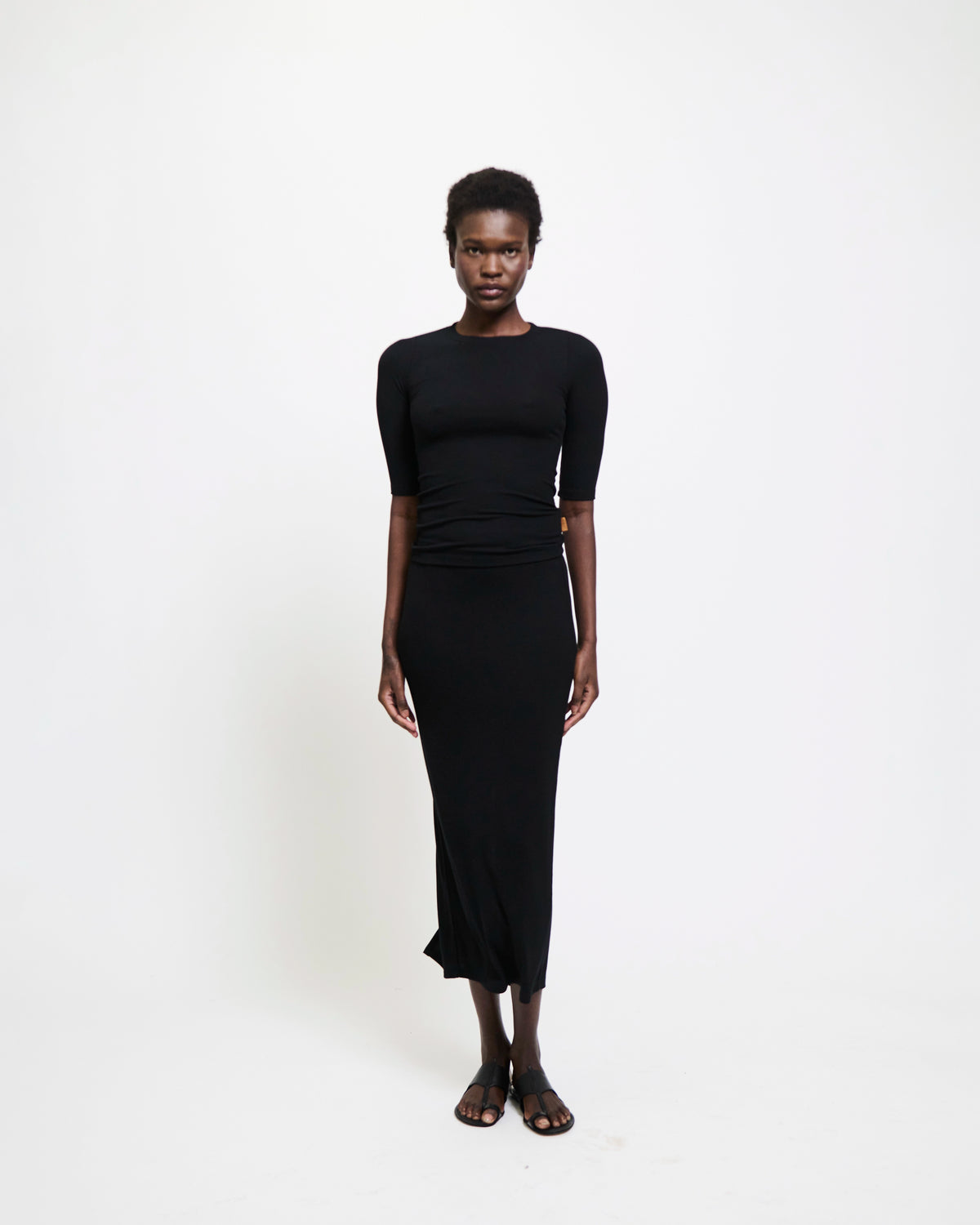 Model wearing The Rib Pencil Skirt in Black by Jamie Haller.