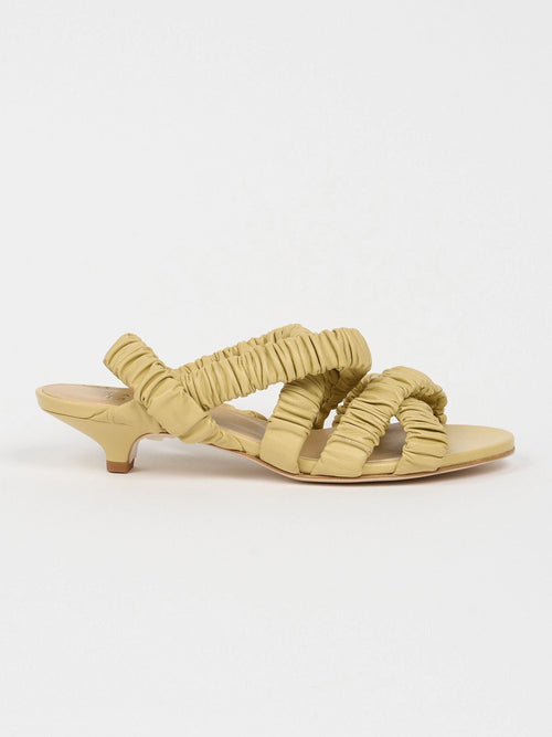 Jamie Haller scrunchie heel in butter on white backdrop