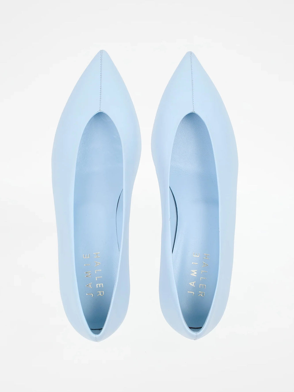 Jamie Haller light blue leather pump with a soft pointed toe, enclosed silhouette and low trapezoidal heel.