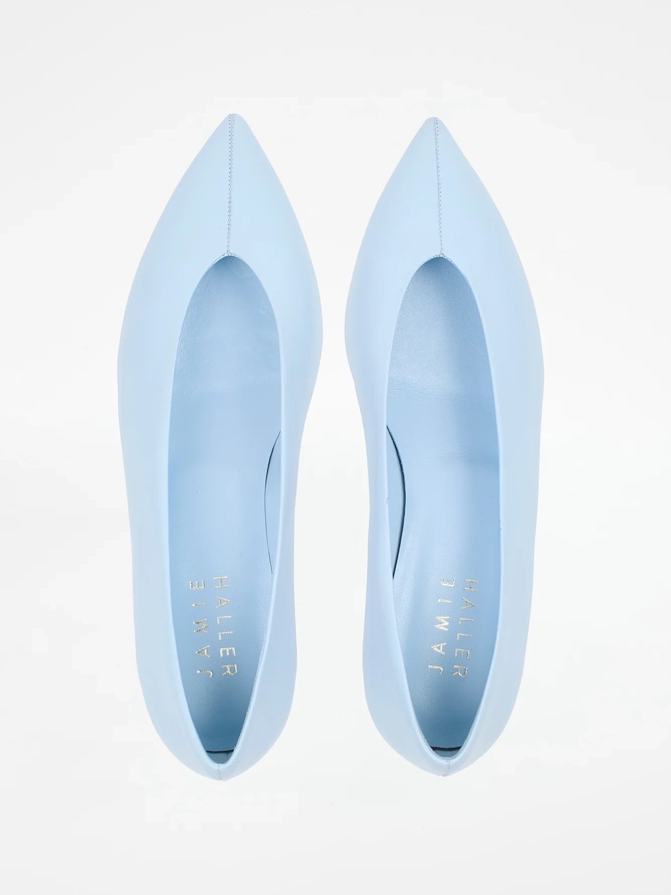 Jamie Haller light blue leather pump with a soft pointed toe, enclosed silhouette and low trapezoidal heel.