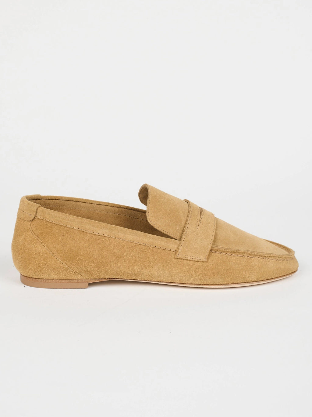 Jamie Haller unlined penny loafer in ambra suede with a warm tan tone, low-profile silhouette and flexible construction.