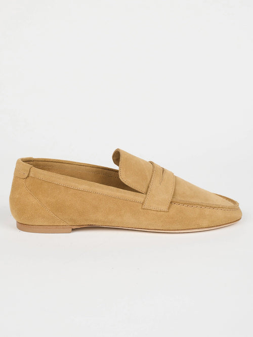 Jamie Haller unlined penny loafer in ambra suede with a warm tan tone, low-profile silhouette and flexible construction.