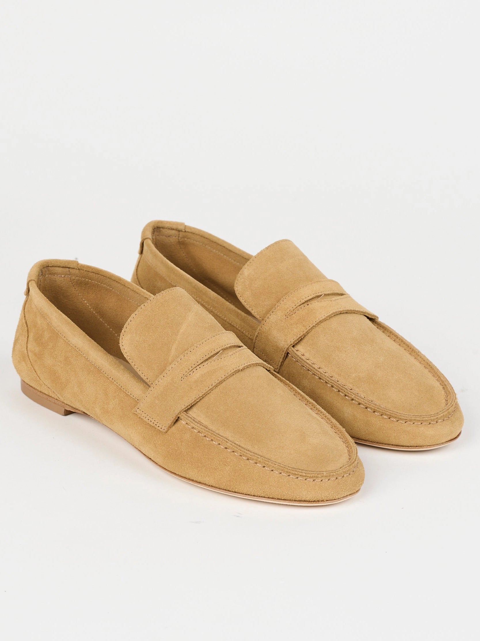 Jamie Haller unlined penny loafer in ambra suede with a warm tan tone, low-profile silhouette and flexible construction.