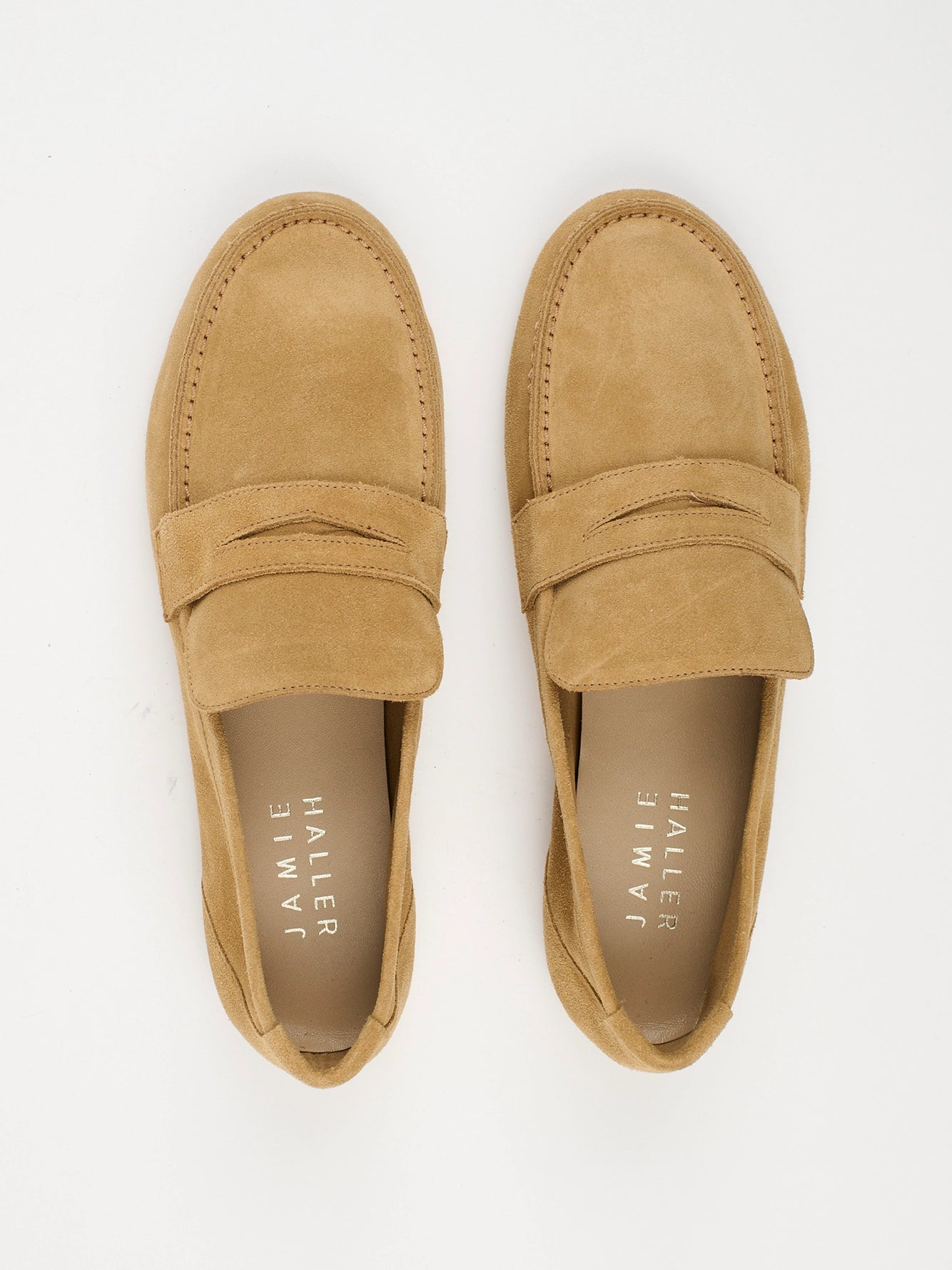 Jamie Haller unlined penny loafer in ambra suede with a warm tan tone, low-profile silhouette and flexible construction.