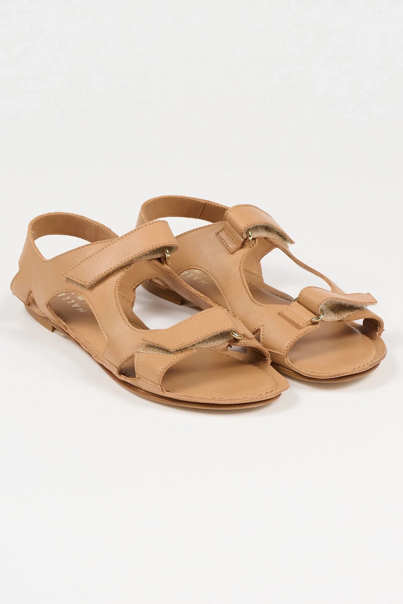 Jamie Haller walking sandal in  natural Italian calfskin with intersecting cutout straps, velcro closures and a flat leather sole.