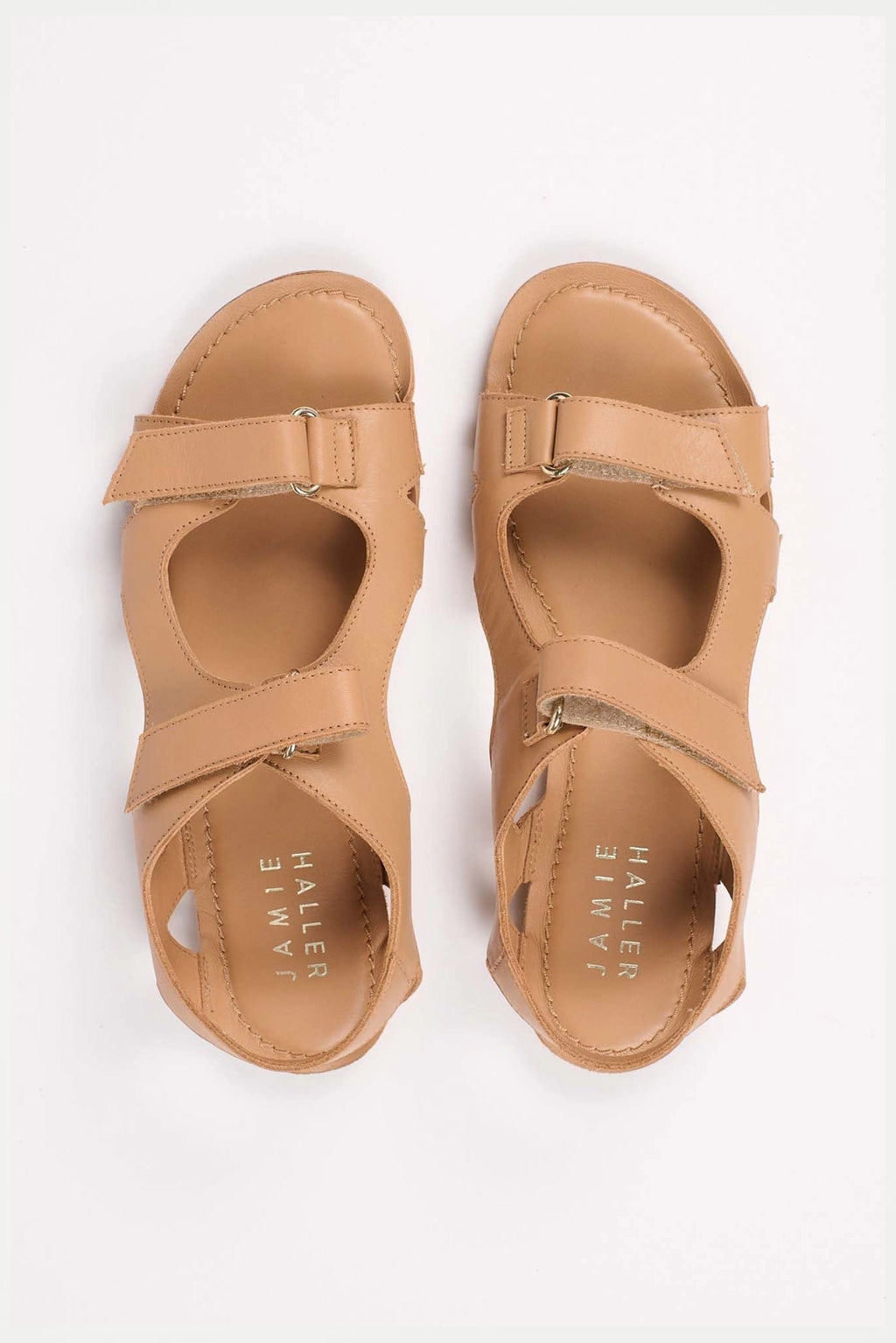Jamie Haller walking sandal in  natural Italian calfskin with intersecting cutout straps, velcro closures and a flat leather sole.