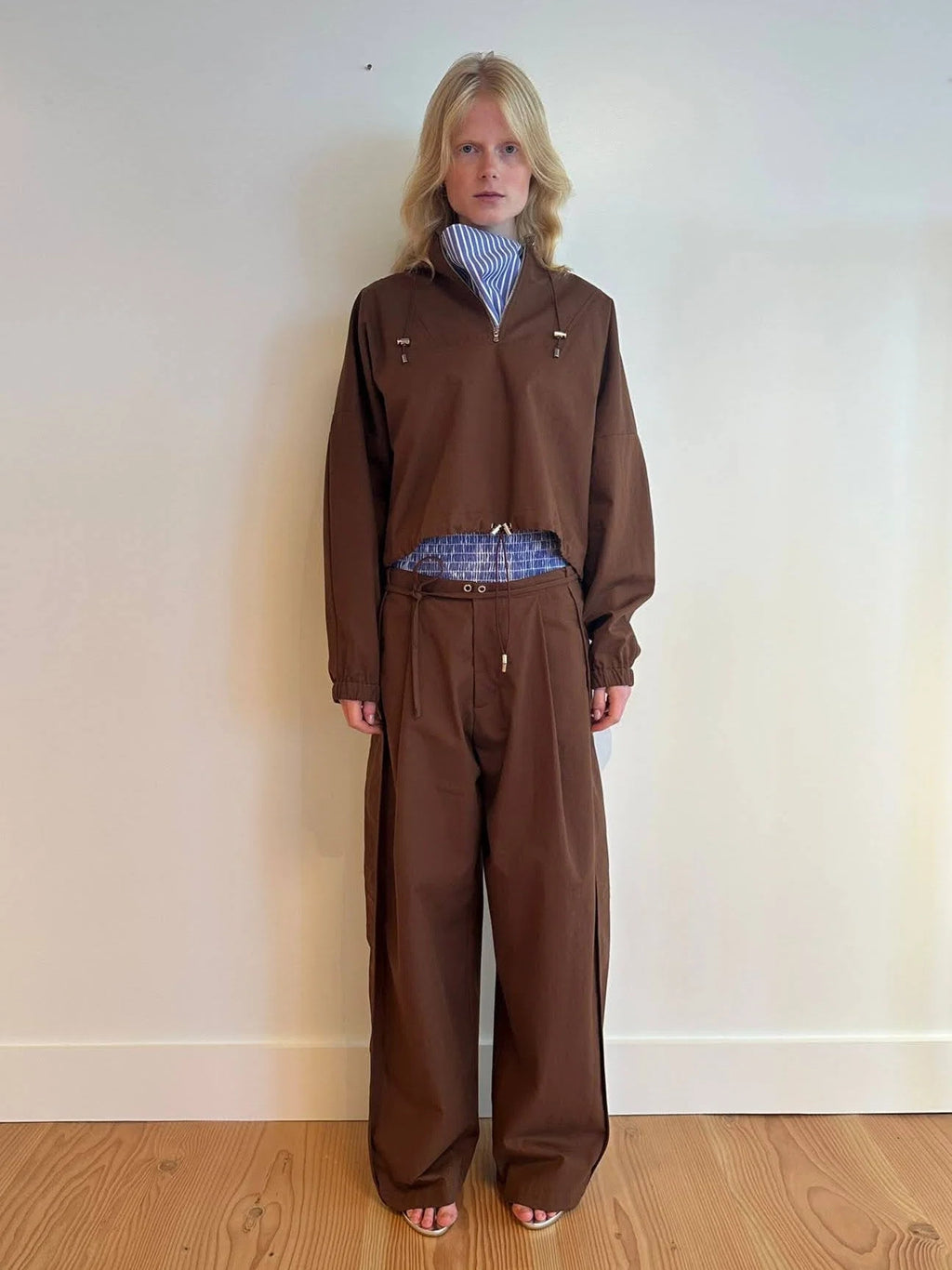 NOMIA Side Panel Pant in russet with a wide leg and slight taper, drawcord waist and side panel detail, worn with matching top.