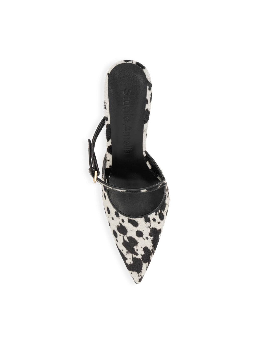 Black and white cow print pointed-toe shoe on a white background