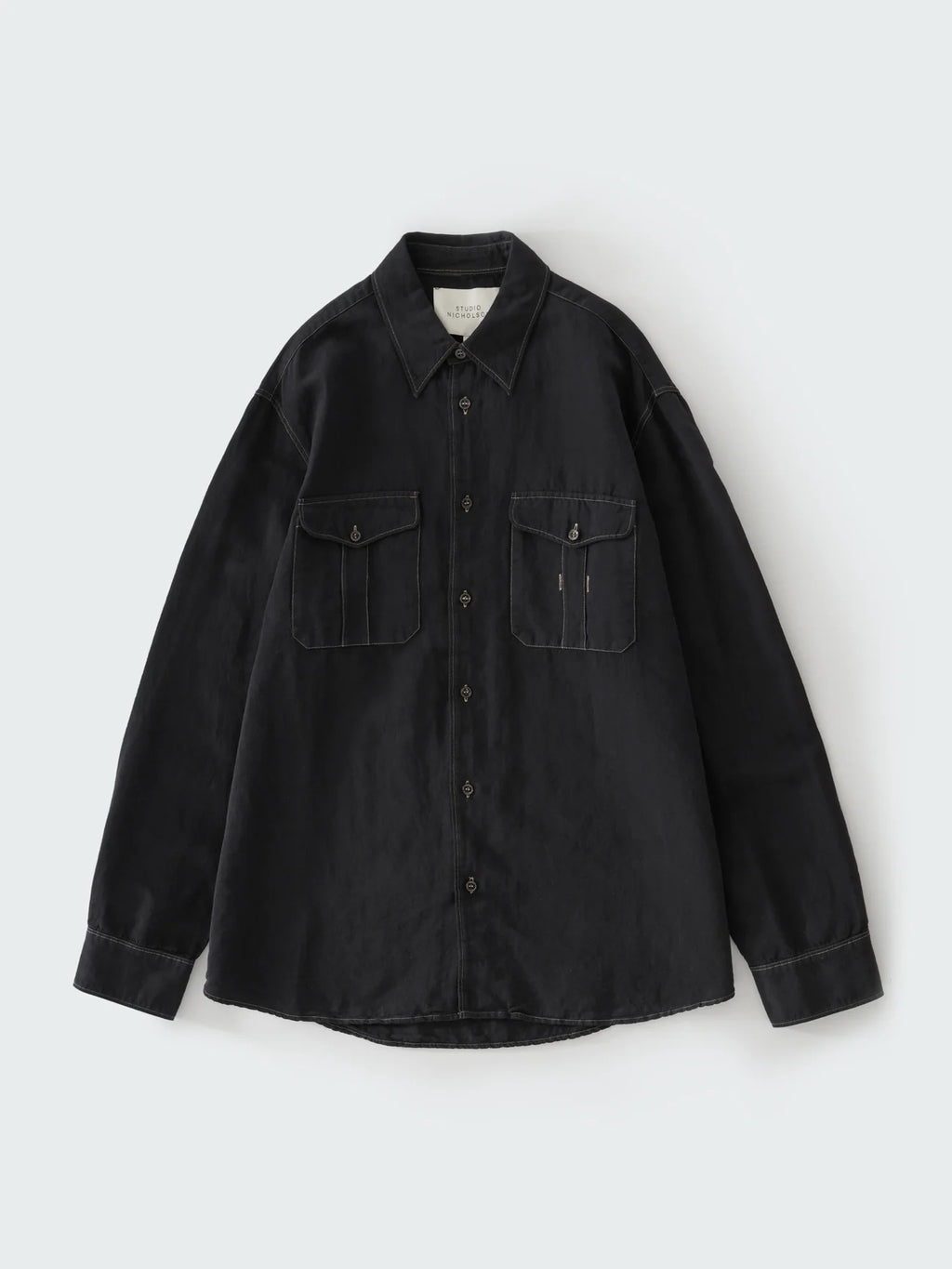 Black shirt with two front pockets on a white background