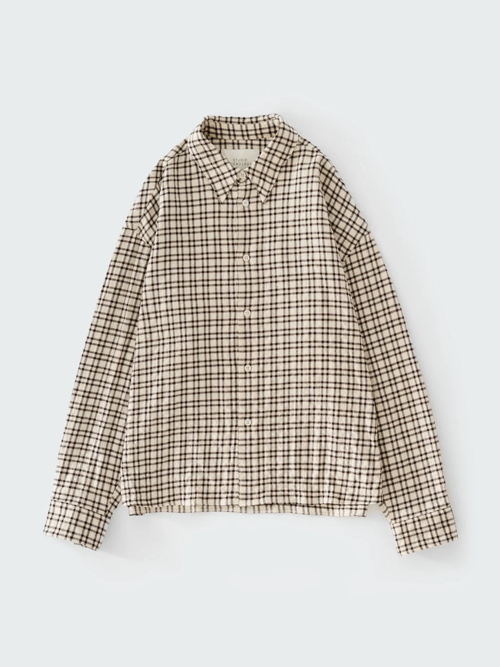 Plaid shirt on a light gray background