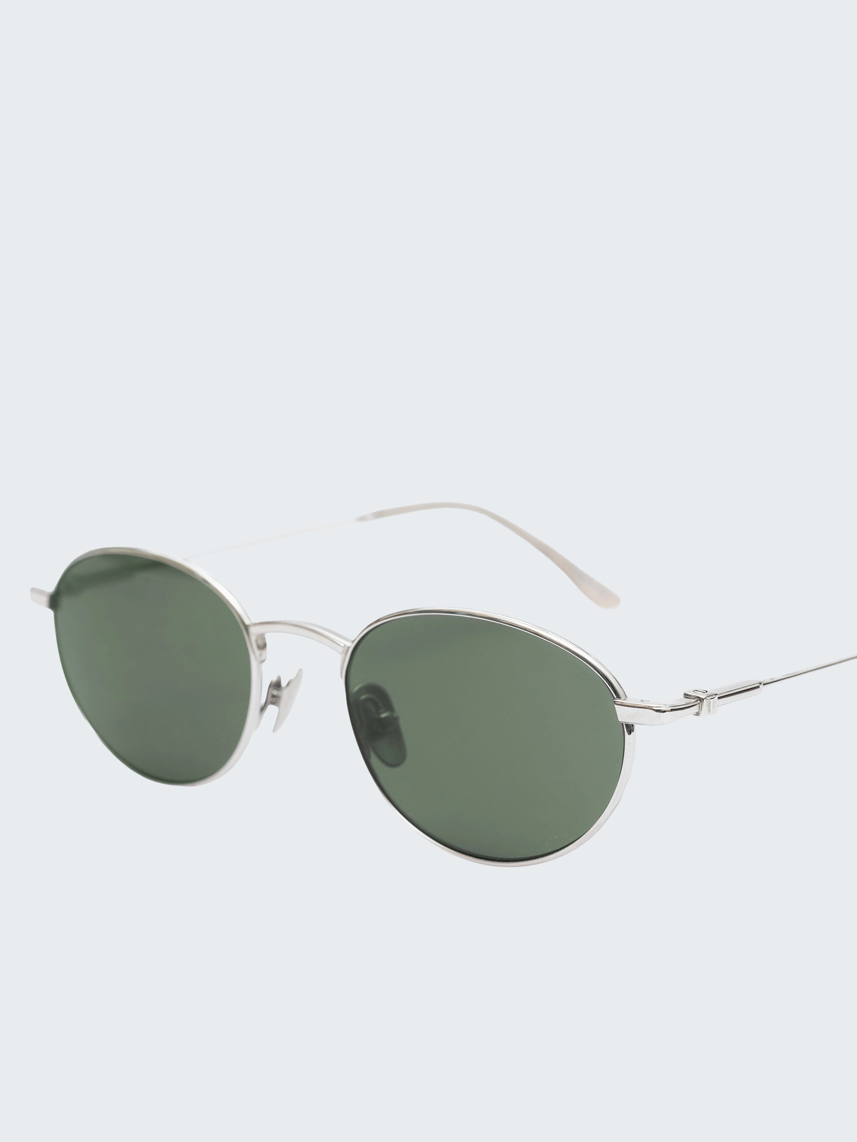 THISTLES CRUZ sunglasses in silver titanium with an oval wire frame silhouette and dark green G15 lenses.
