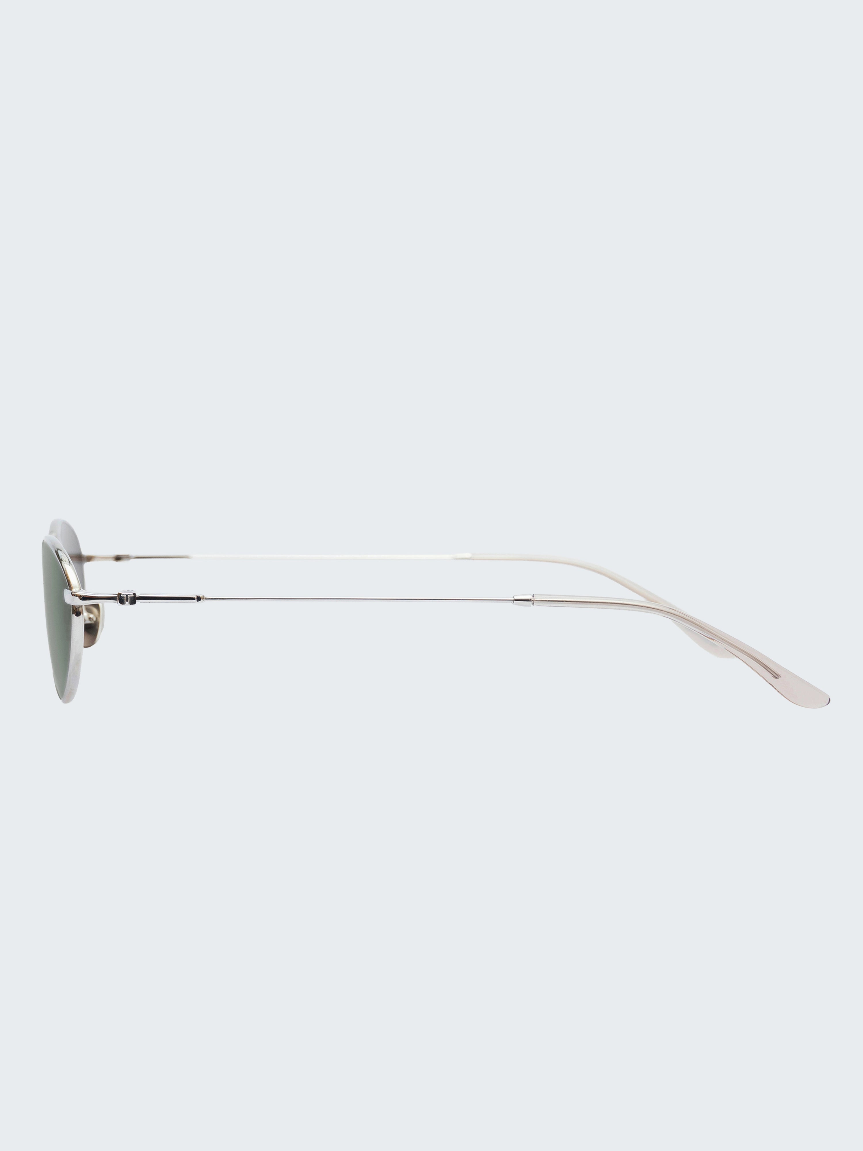 THISTLES CRUZ sunglasses in silver titanium with an oval wire frame silhouette and dark green G15 lenses.